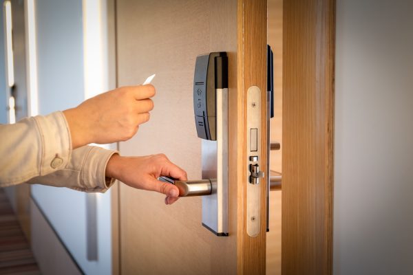 Opening a hotel door with keyless entry card.