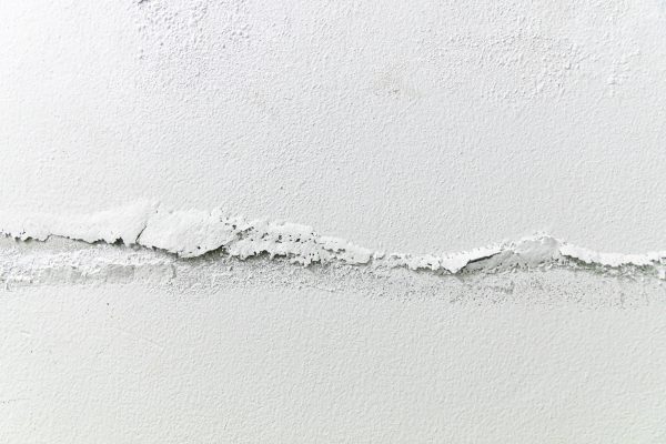 cracks in cement wall white cement wall