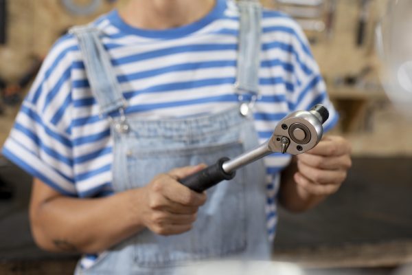 close-up-blurry-worker-holding-tool