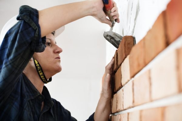 constructor-construction-repair-plastering-on-the-wall-e1648585478990