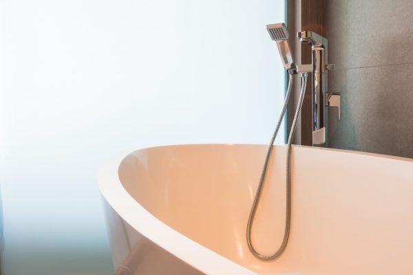 White luxury bathtub decoration in bathroom interior